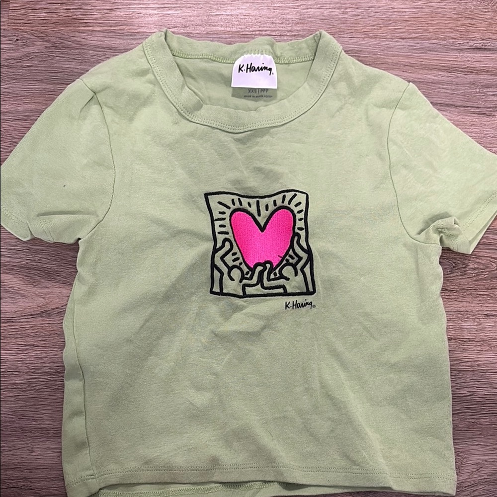 COTTON ON Keith Haring Green T-Shirt with Pink Heart Design